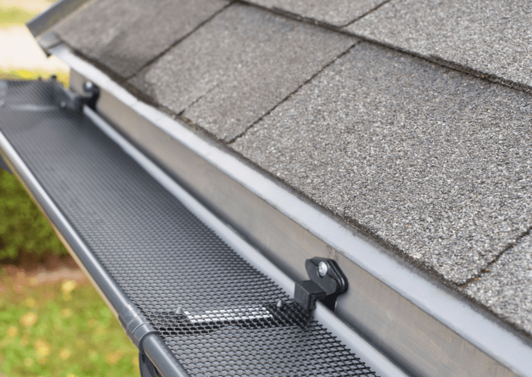 Close-up of a newly installed gutter guard, showcasing professional gutter replacement services for a home.