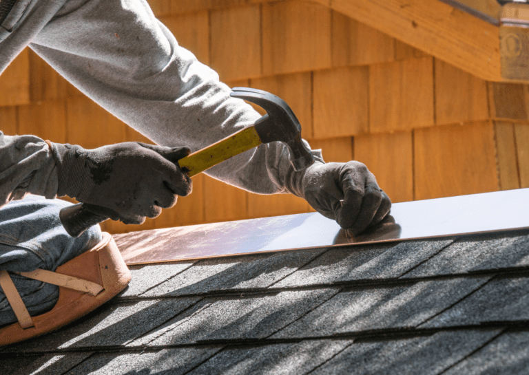 Close-up of hail damage on a roof, emphasizing the need for professional roof repair solutions.